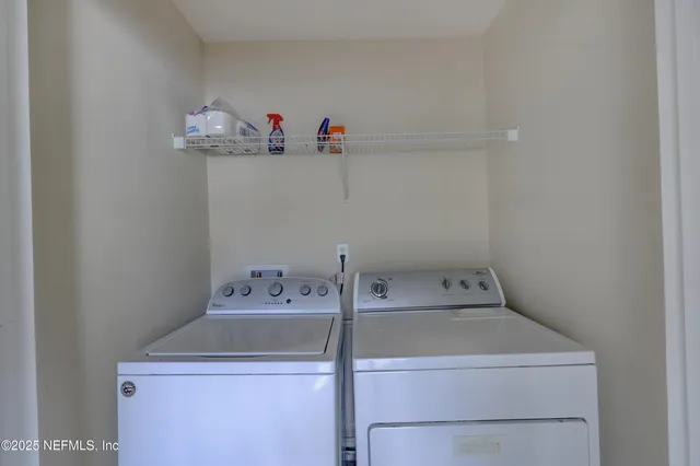 a utility room with dryer and washer