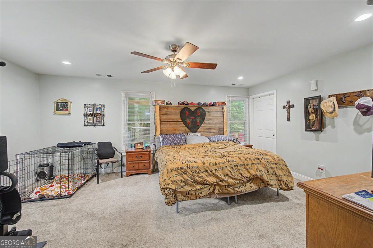 483 Coal Road Northwest Resaca, GA 30735 - Photo 26 of 56 a bedroom with a bed and a chandelier