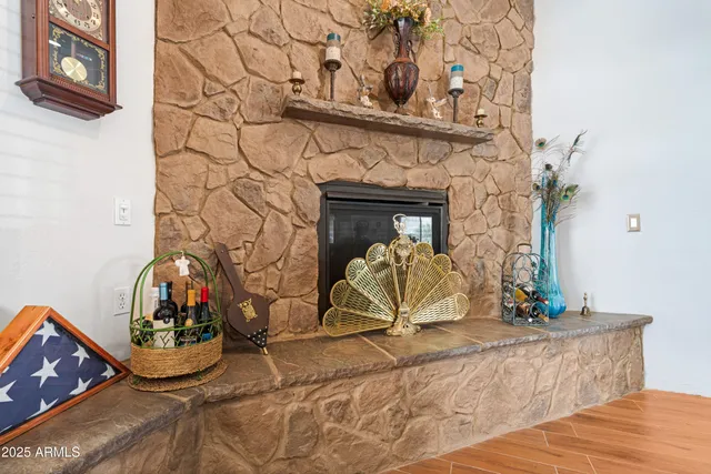 a living room with furniture a rug and a flat screen tv