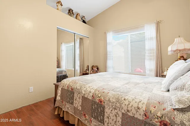 a bedroom with a bed and a window