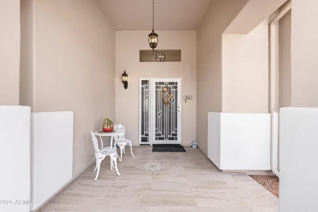 a front view of a house with outdoor seating