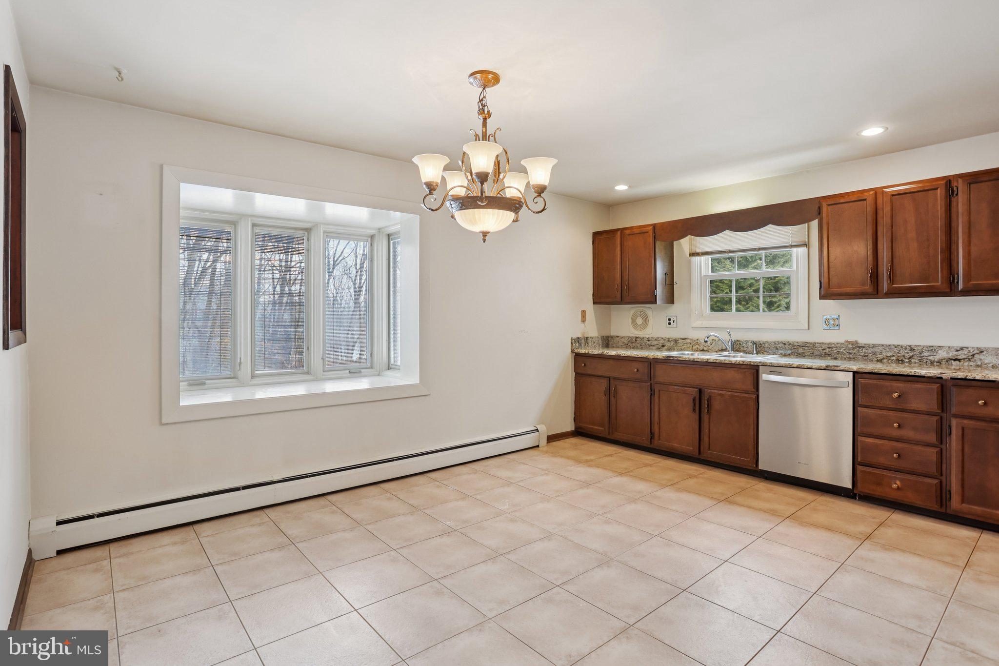 194 Long Lane Kirkwood, PA 17536 - Photo 4 of 56 a kitchen with stainless steel appliances granite countertop a stove a sink and a refrigerator