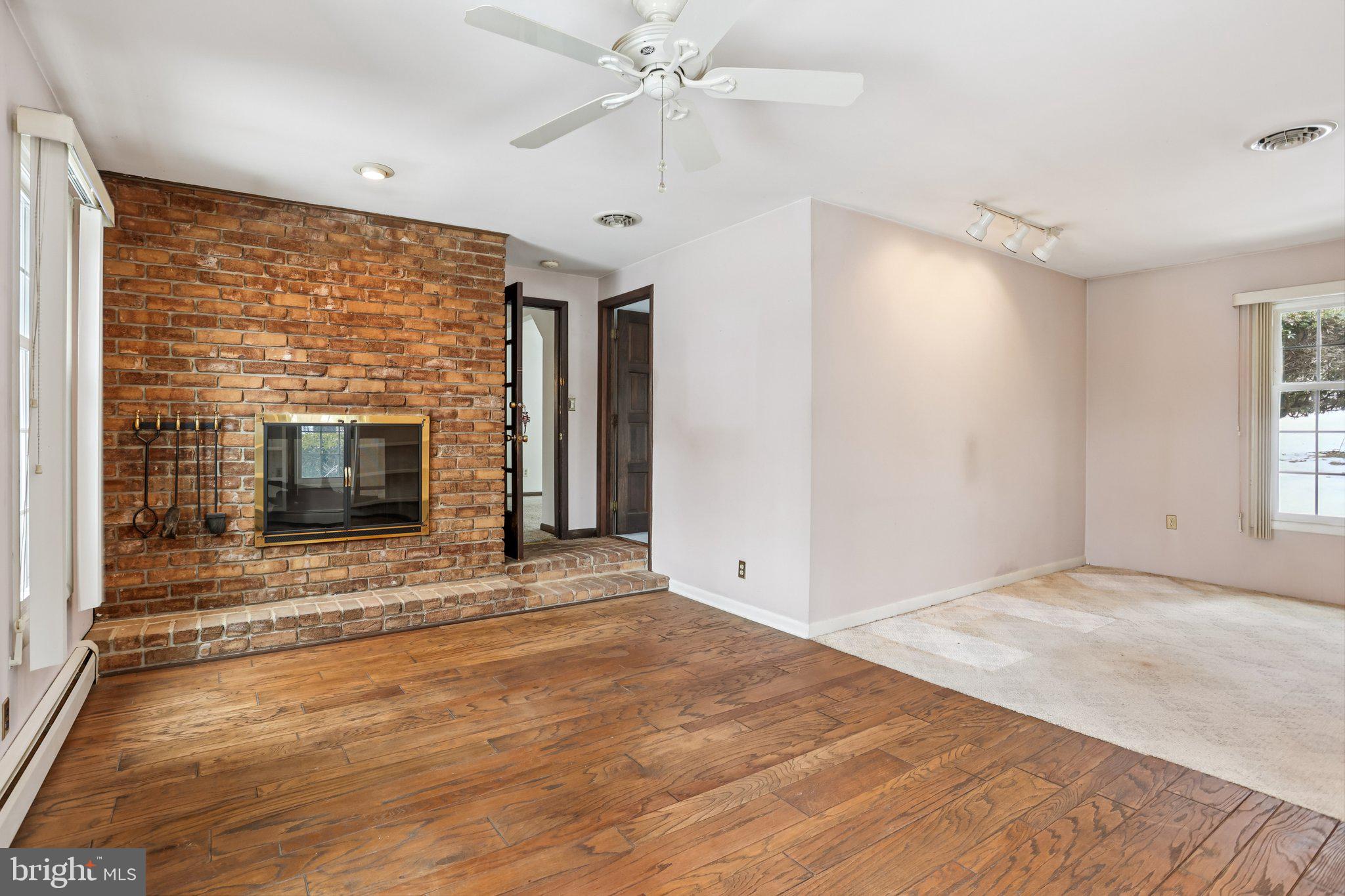 194 Long Lane Kirkwood, PA 17536 - Photo 7 of 56 an empty room with windows and fireplace
