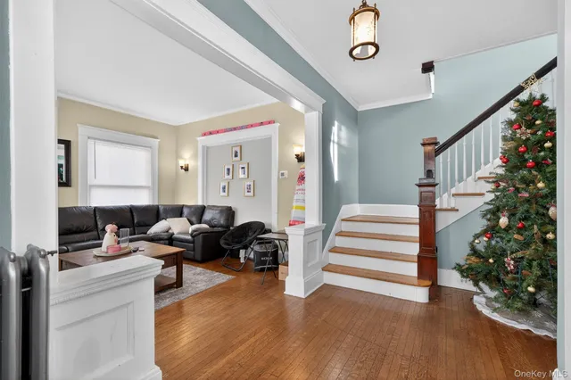 a livingroom with furniture wooden floor and windows