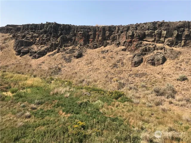 a view of a mountain range with a mountain