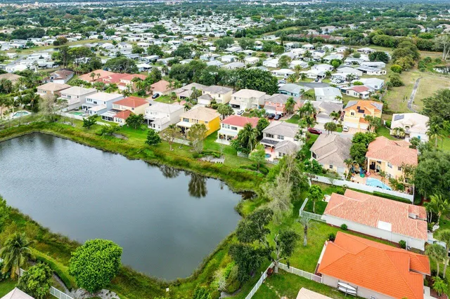an aerial view of a house with a lake view