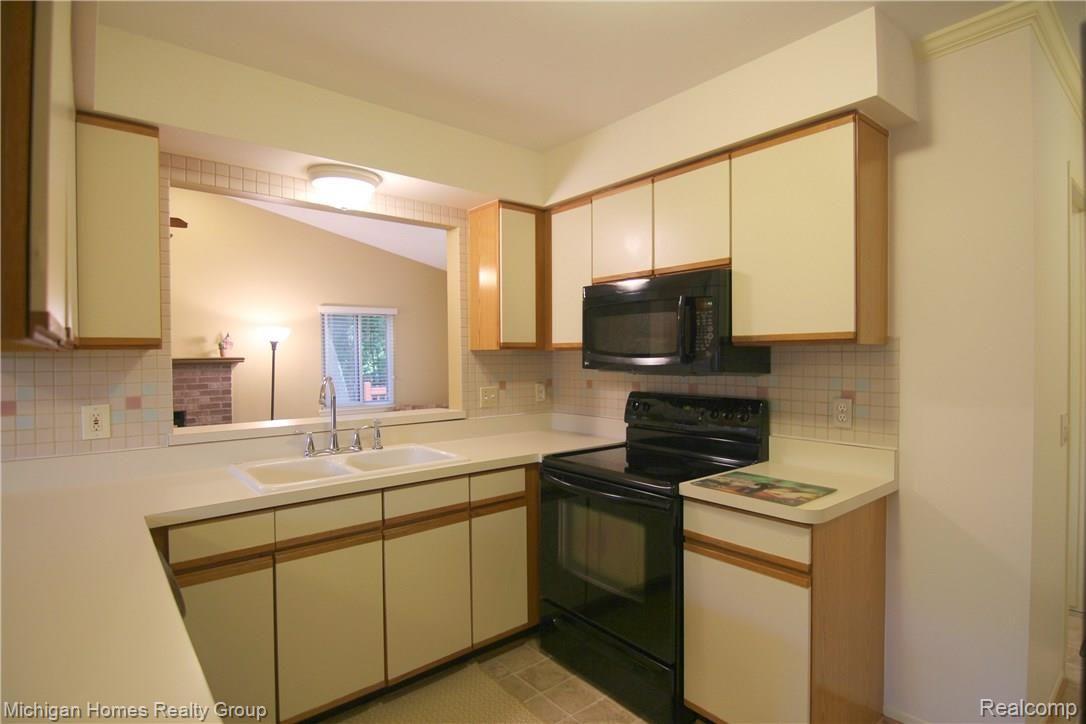 1410 Omega Road Walled Lake, MI 48390 - Photo 10 of 23 Omega Rd Kitchen 3.jpg