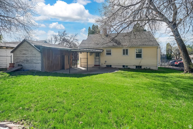 744 North 500 East Logan, UT 84321 - Photo 28 of 29 Back of property featuring a patio area and roof with shingles