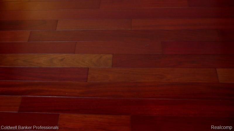 457 Lexington Drive Rochester, MI 48307 - Photo 18 of 34 Close Up View Of Great Room Brazilian Cherry Hardwood Floors!