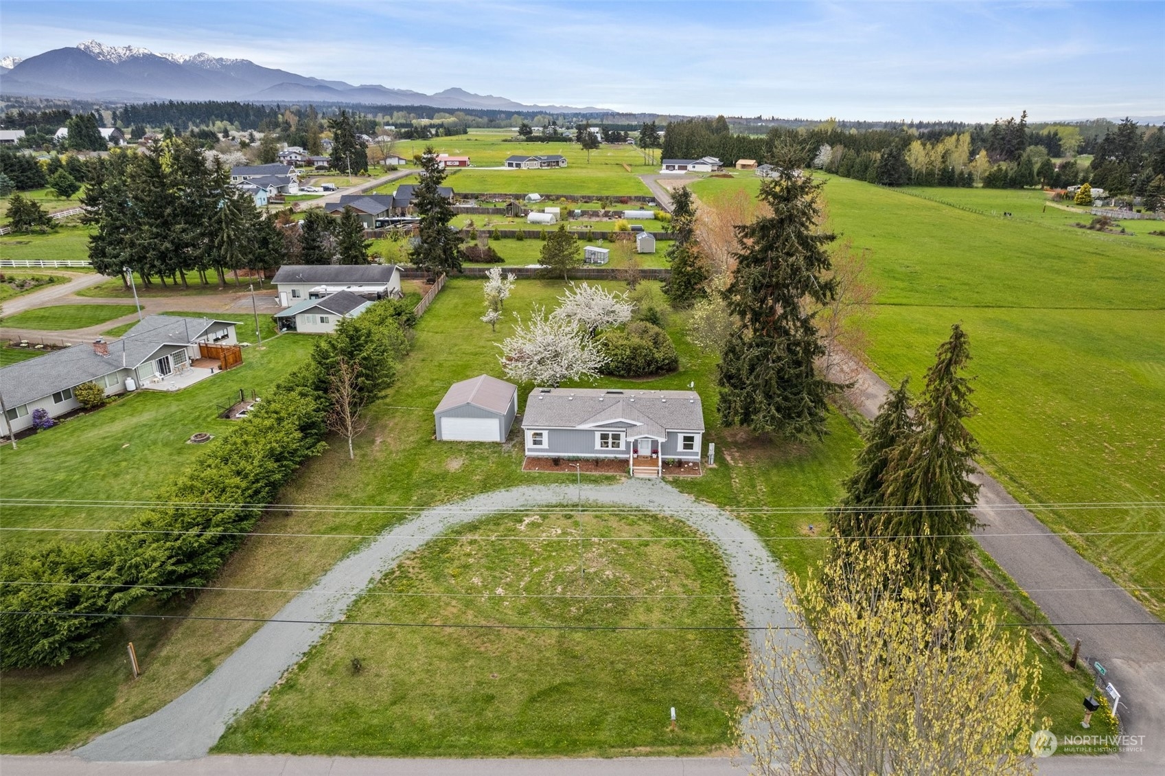 951 Heath Road Sequim, WA 98382 - Photo 2 of 34 a swimming pool with trees in the background