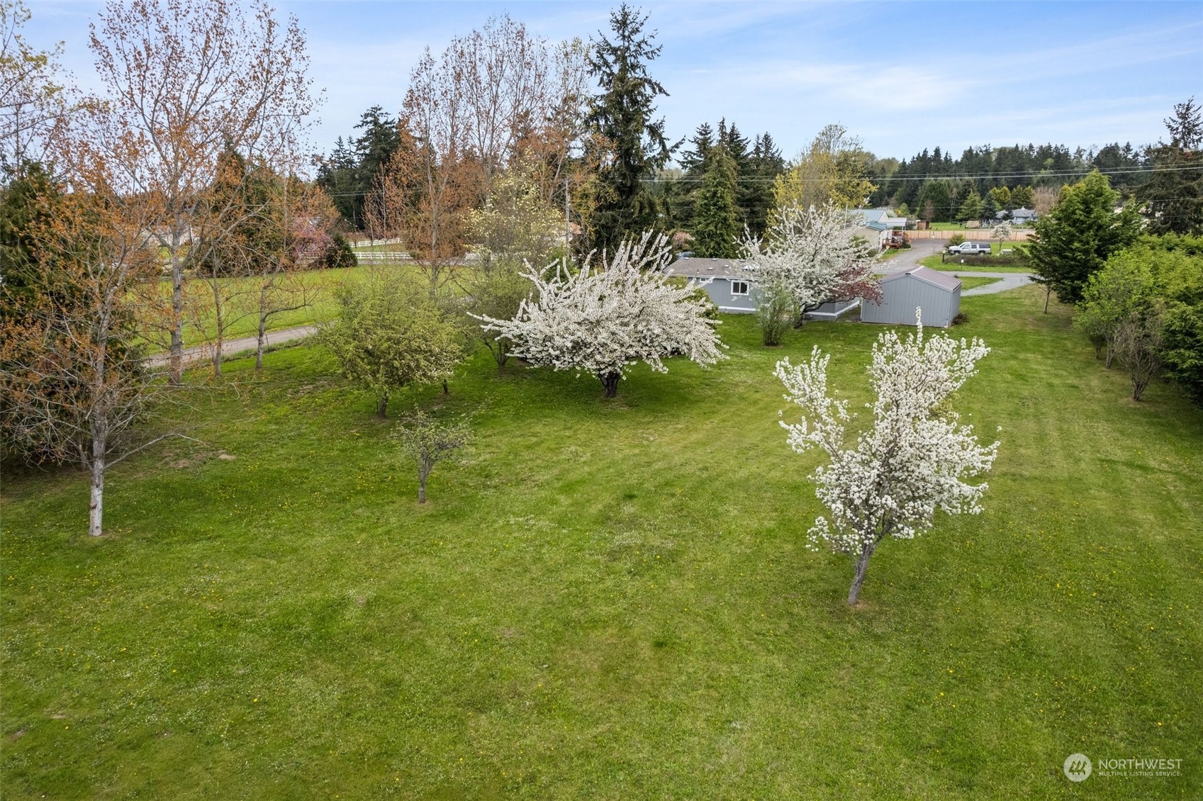 951 Heath Road Sequim, WA 98382 - Photo 34 of 34 a backyard of a house with lots of green space