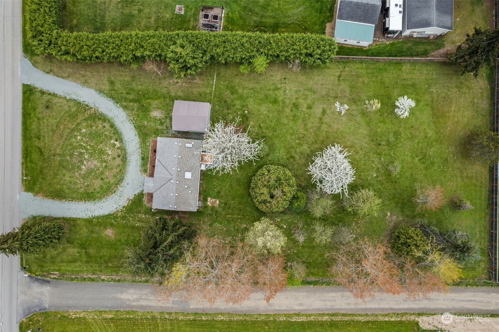 951 Heath Road Sequim, WA 98382 - Photo 4 of 34 an aerial view of a house with a yard