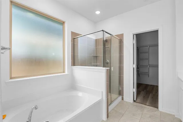 a bathroom with a double vanity sink a toilet and a shower