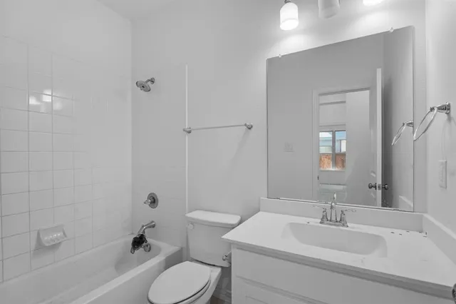 a view of backyard with green space and wooden fence