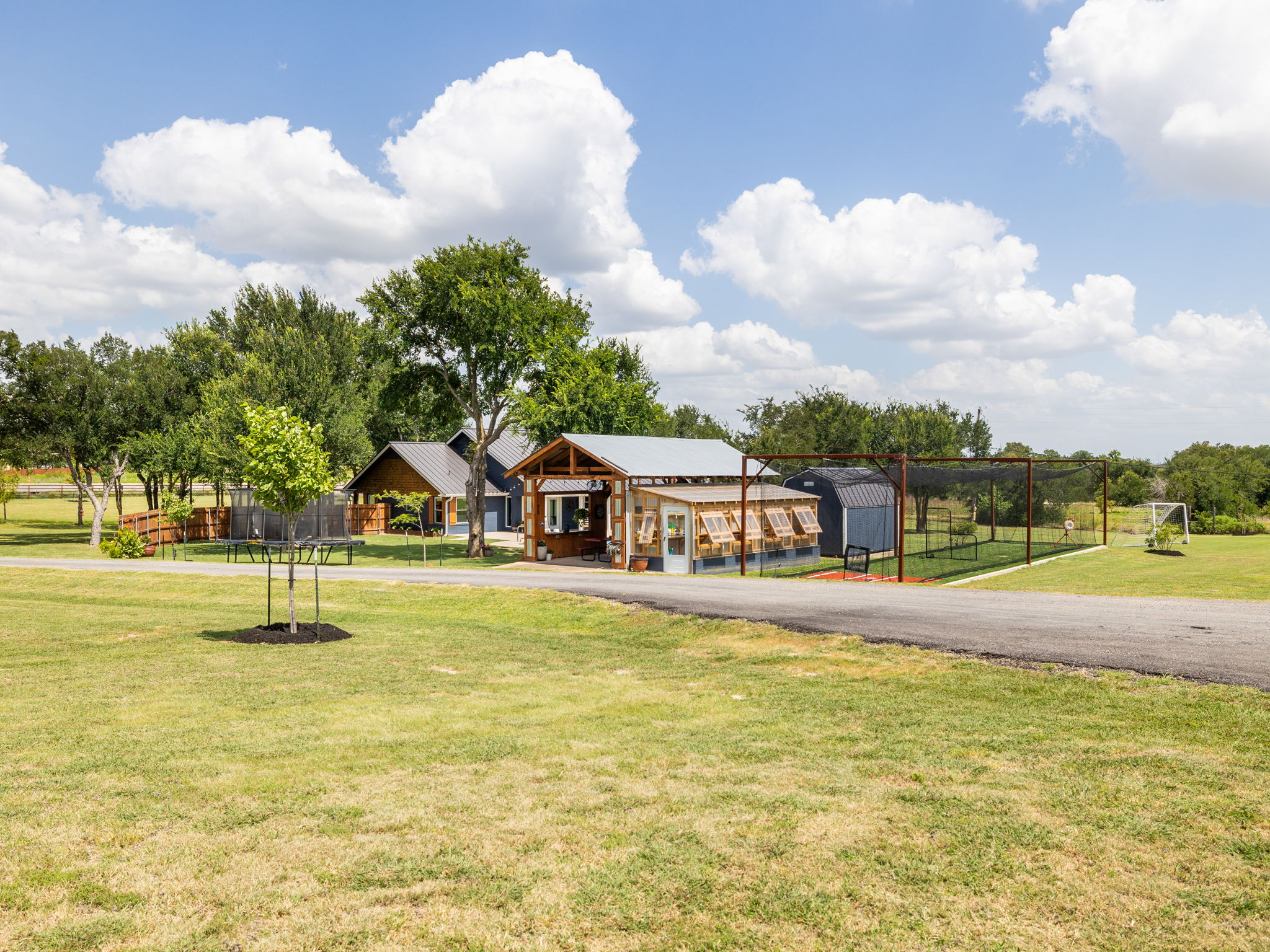 3001 County Road 255 Georgetown, TX 78633 - Photo 22 of 35 A private estate with a greenhouse, batting/golf cage and storage sheds.