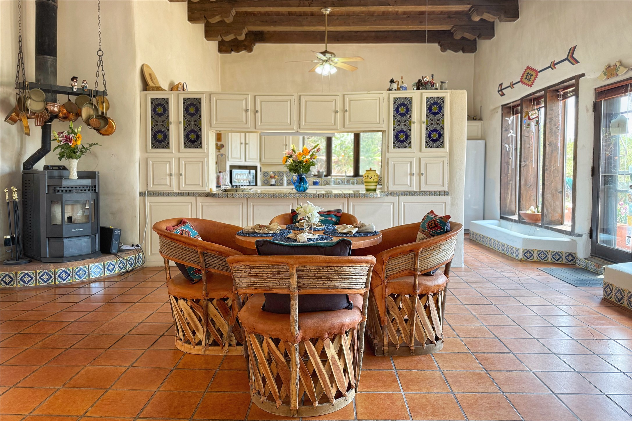 54 Rons Road Santa Fe, NM 87508 - Photo 18 of 99 Open area dining, multi purpose with pellet stove
