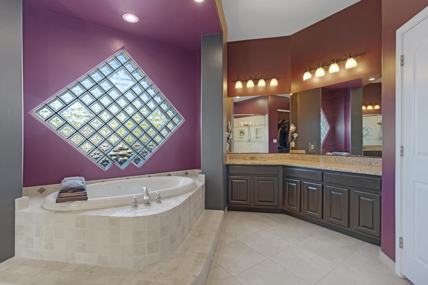 8540 East McDowell Road, Unit 10 Mesa, AZ 85207 - Photo 15 of 25 a bathroom with a bathtub sink and mirror