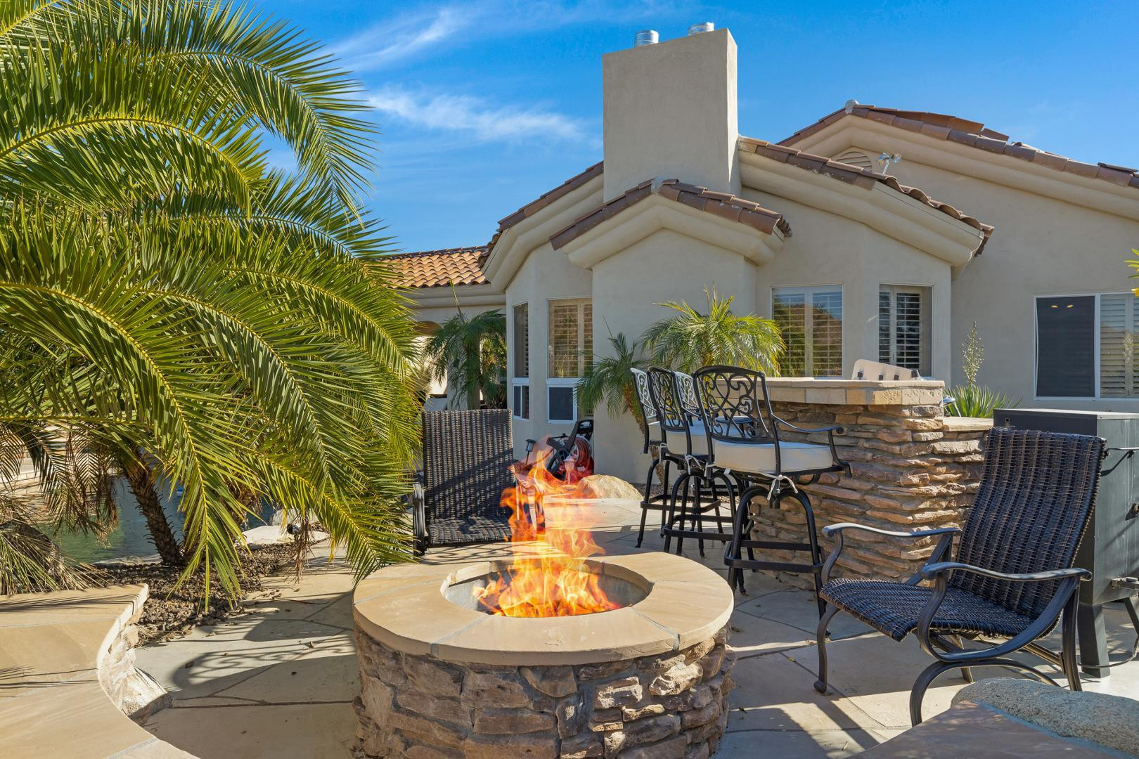8540 East McDowell Road, Unit 10 Mesa, AZ 85207 - Photo 24 of 25 a view of a patio with table and chairs and potted plants