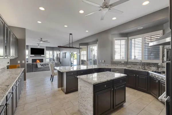 a large kitchen with a large counter top space