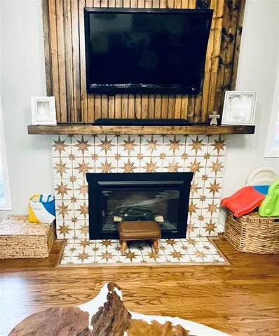 a room with granite countertop a stove and a wooden floor