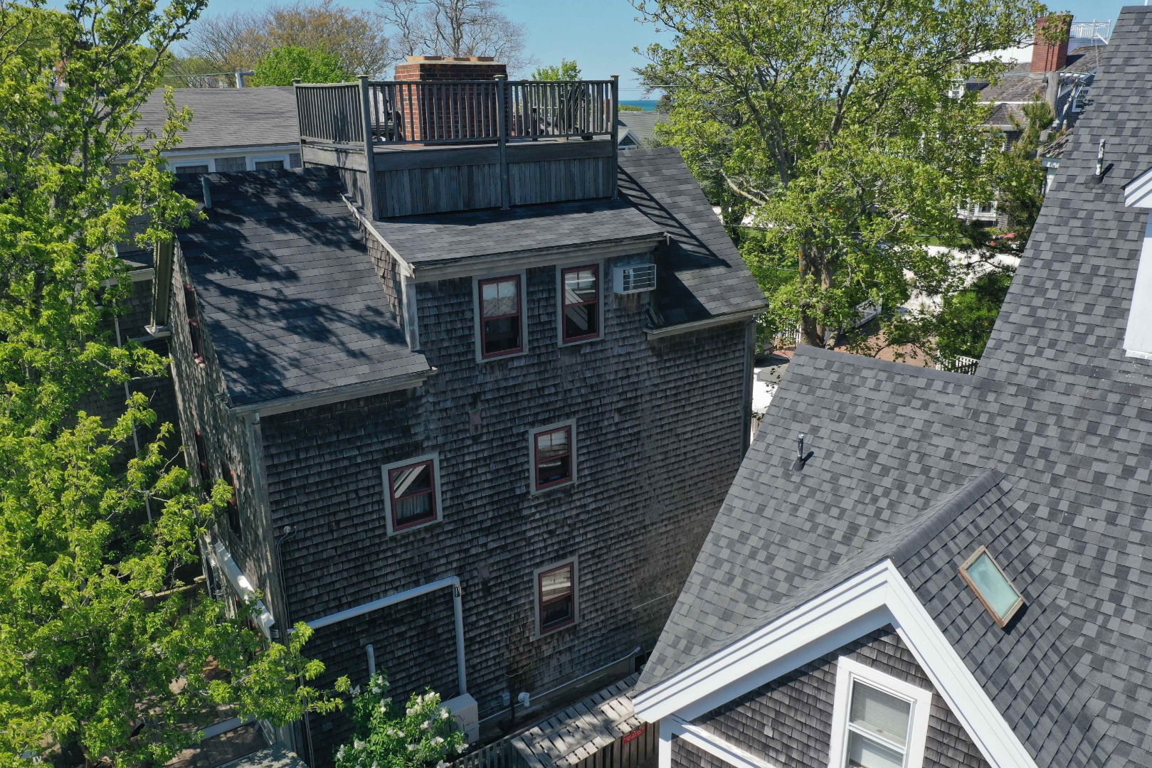 10 A Cliff Road Nantucket, MA 02554 - Photo 4 of 16 a front view of a house with a tree