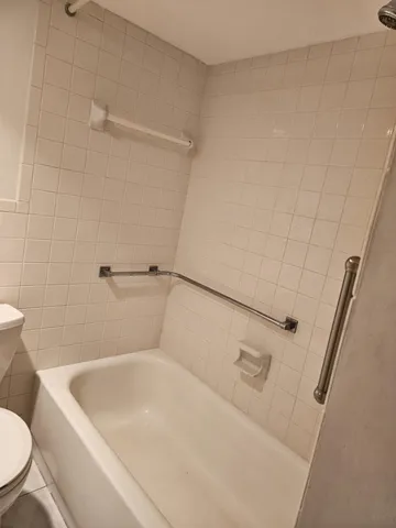 a bathroom with a toilet sink and vanity