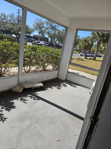a view of a floor to ceiling window and an outdoor space
