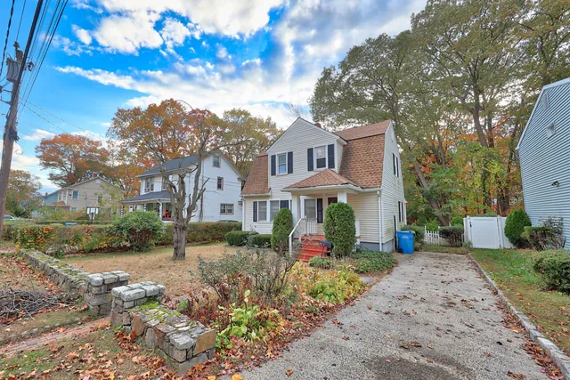 a front view of a house with garden