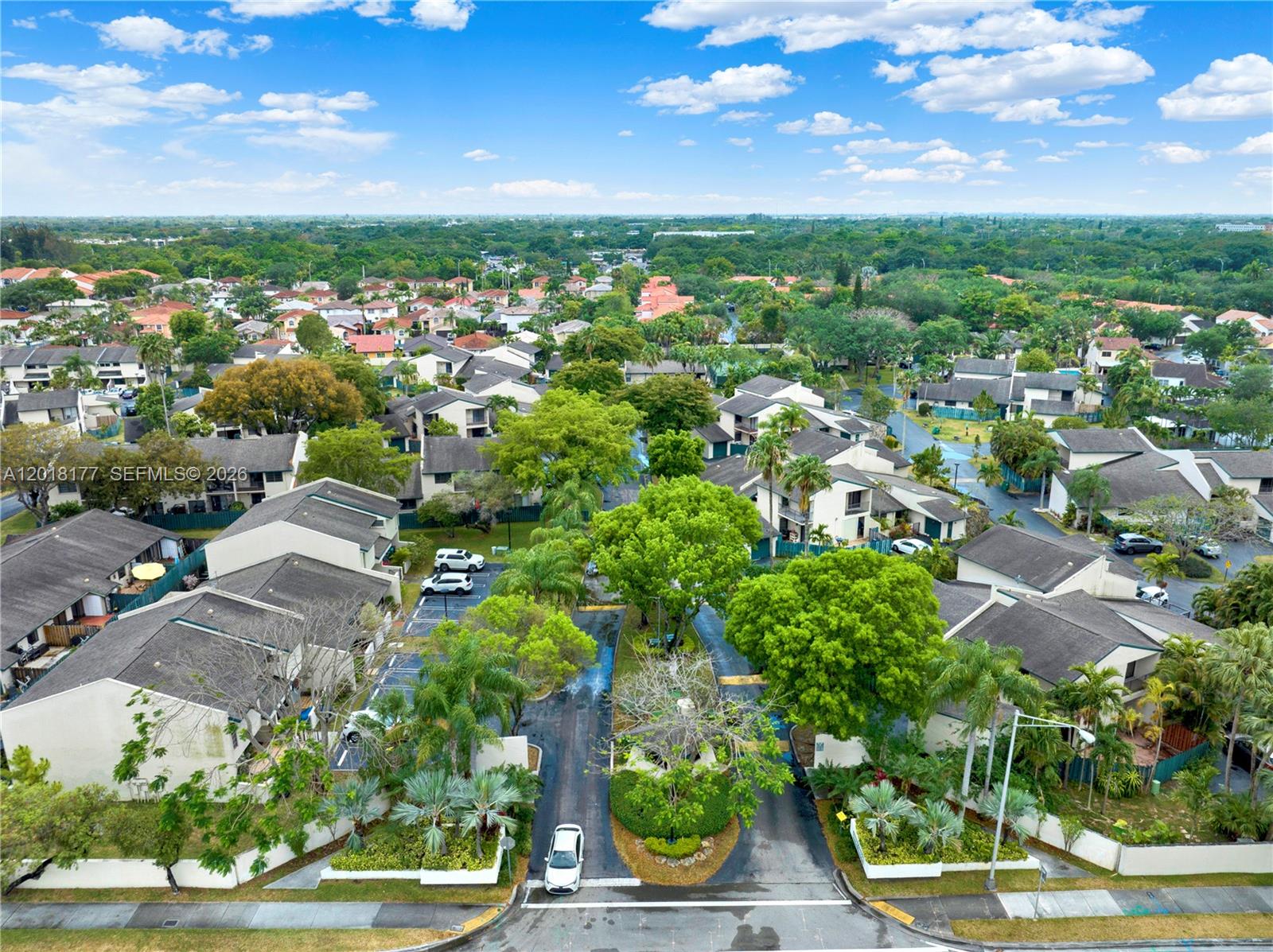 10908 Southwest 72nd Street, Unit 215 Miami, FL 33173 - Photo 17 of 25 an aerial view of residential houses with outdoor space and street view