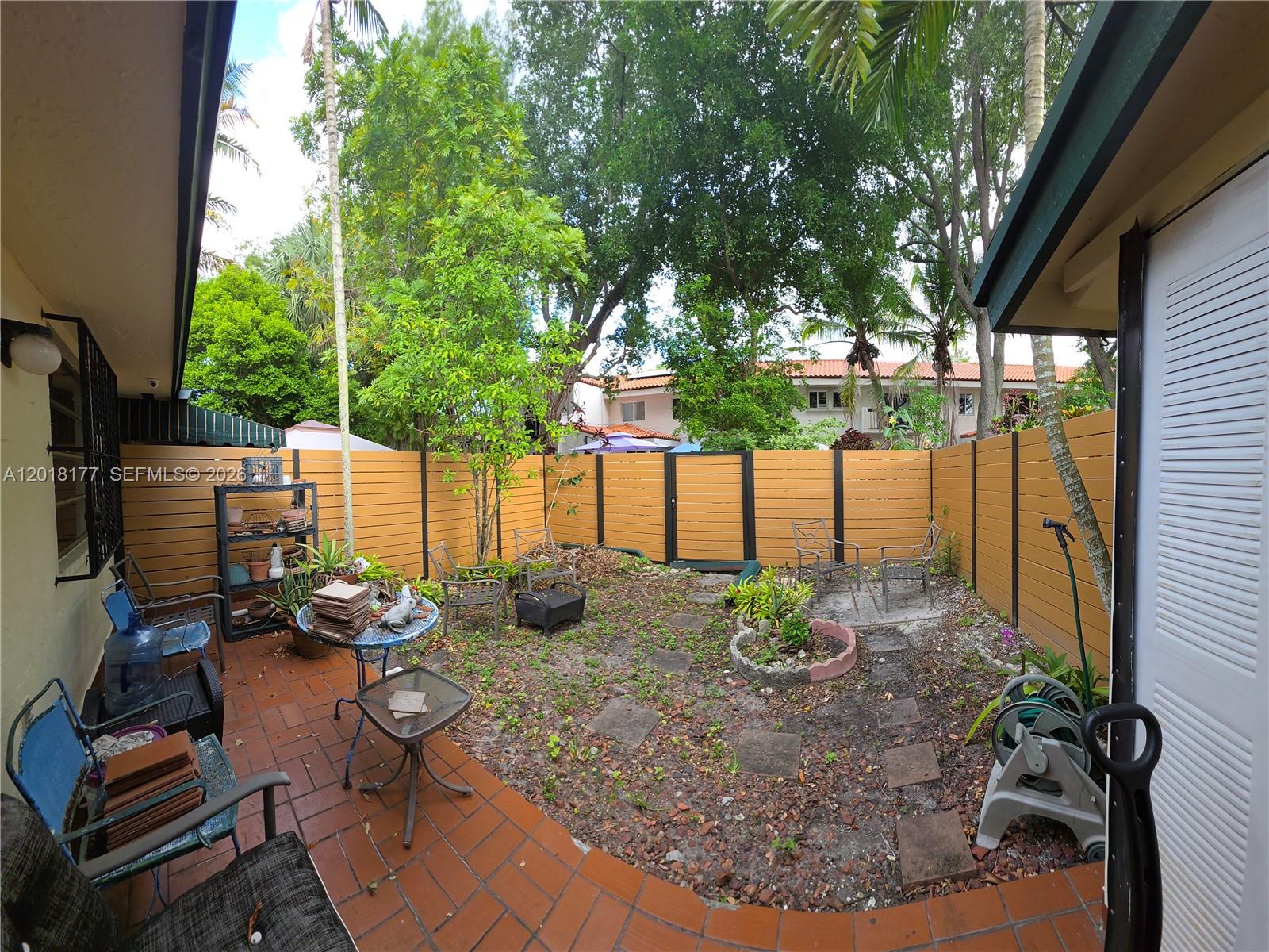 10908 Southwest 72nd Street, Unit 215 Miami, FL 33173 - Photo 3 of 25 a view of outdoor space yard and patio