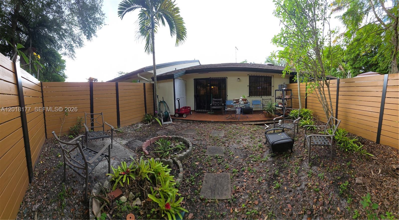 10908 Southwest 72nd Street, Unit 215 Miami, FL 33173 - Photo 4 of 25 a view of a chairs and tables in the backyard