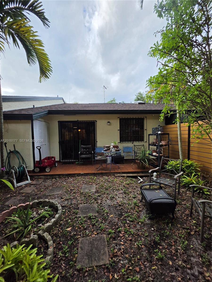 10908 Southwest 72nd Street, Unit 215 Miami, FL 33173 - Photo 5 of 25 a front view of a house with garden