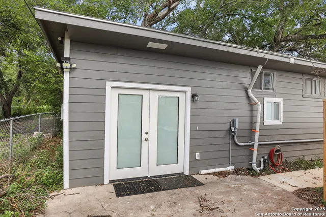 a side view of a house with a yard