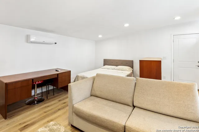 a bedroom with a bed and furniture