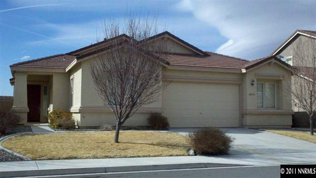 10471 Blockade Drive Reno, NV 89521 - Photo 1 of 1 a house that has a tree in front of it