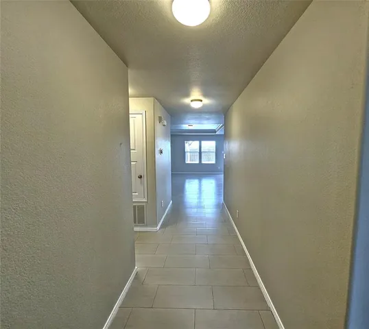 a view of hallway with a window