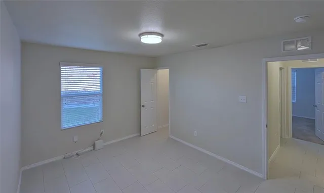 an empty room with windows