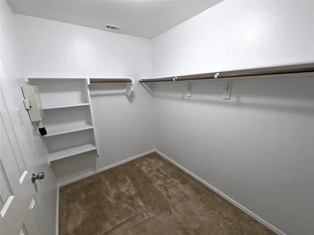 a view of an empty walk in closet