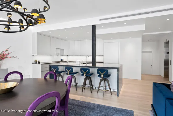 a view of kitchen and dining area with furniture