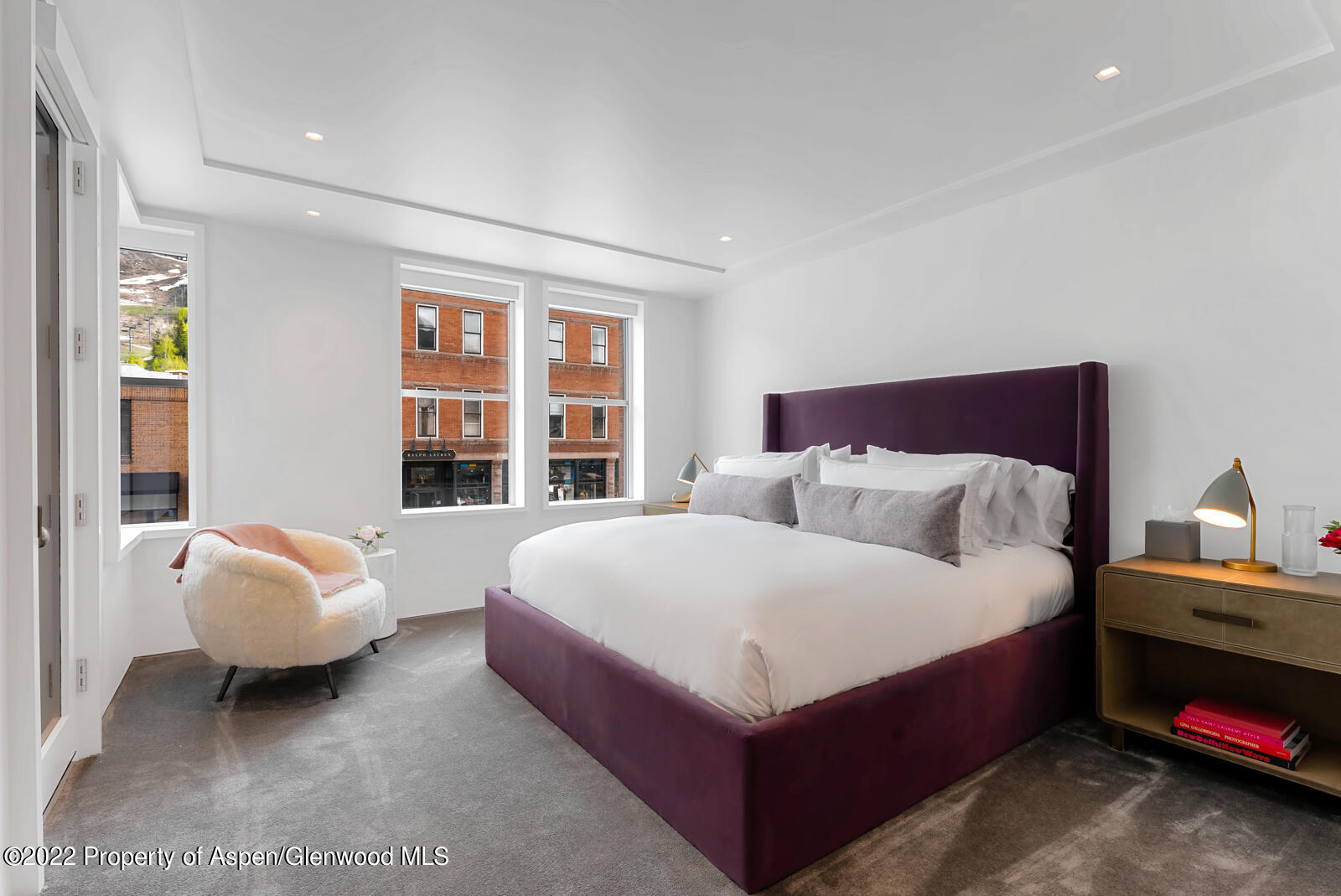 508 East Cooper Avenue, Unit 201 Aspen, CO 81611 - Photo 31 of 54 a spacious bedroom with a bed and a large window