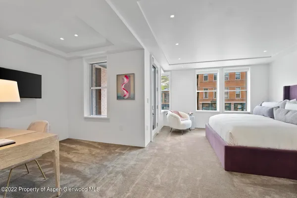 a bathroom with a sink toilet vanity and shower