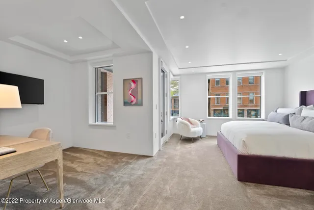 a bathroom with a sink toilet vanity and shower