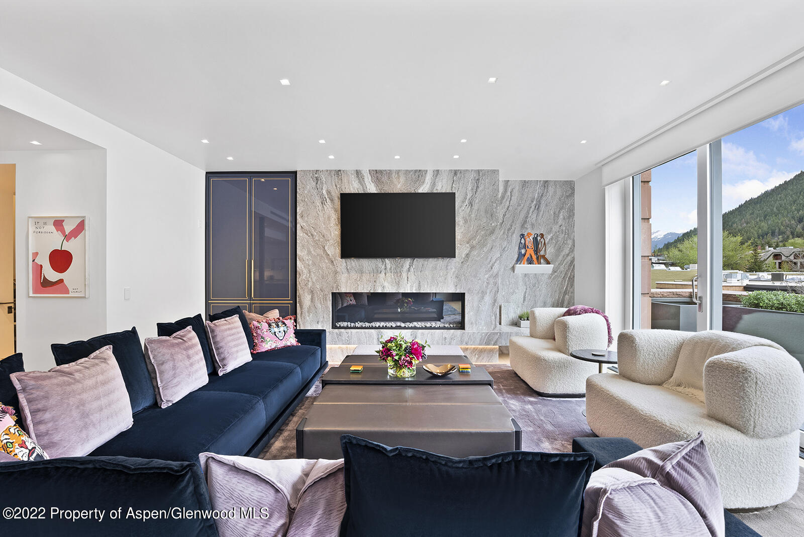 508 East Cooper Avenue, Unit 201 Aspen, CO 81611 - Photo 4 of 54 a living room with furniture fireplace and a flat screen tv