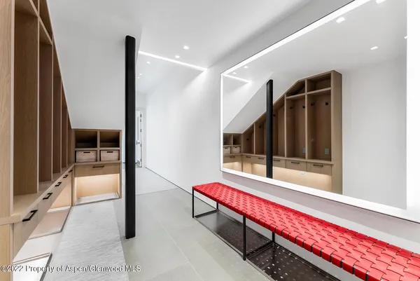 a view of a swimming pool with a table and chairs a fire pit