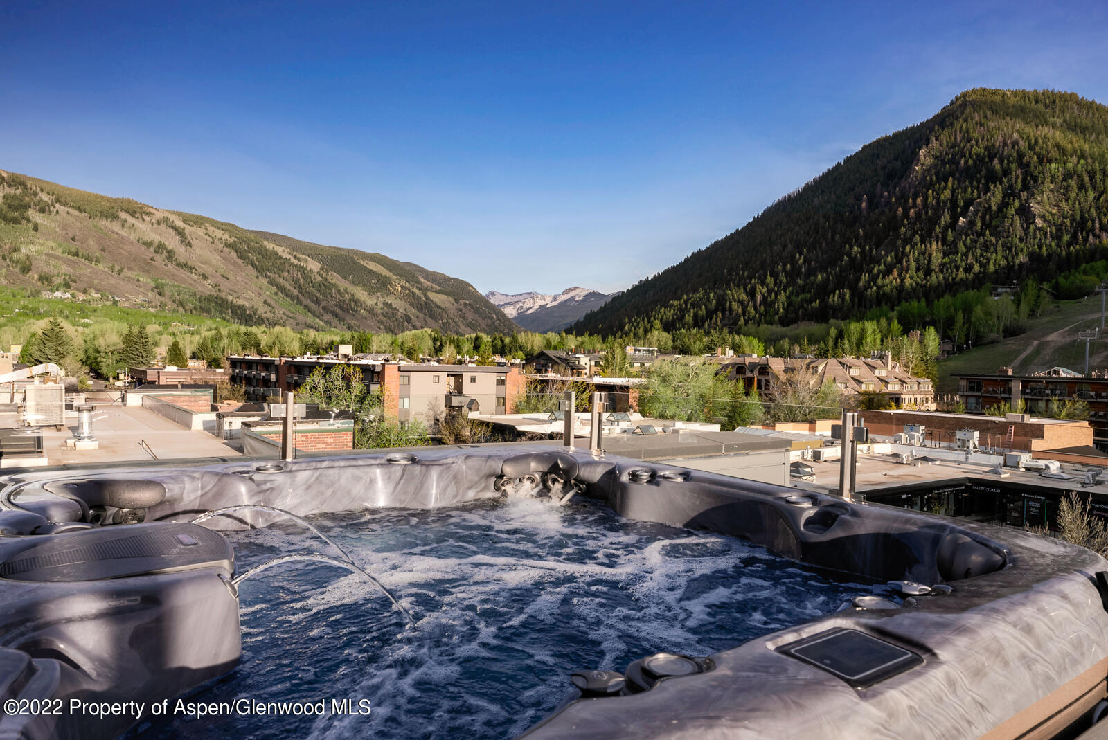 508 East Cooper Avenue, Unit 201 Aspen, CO 81611 - Photo 44 of 54 a view of a swimming pool with a patio