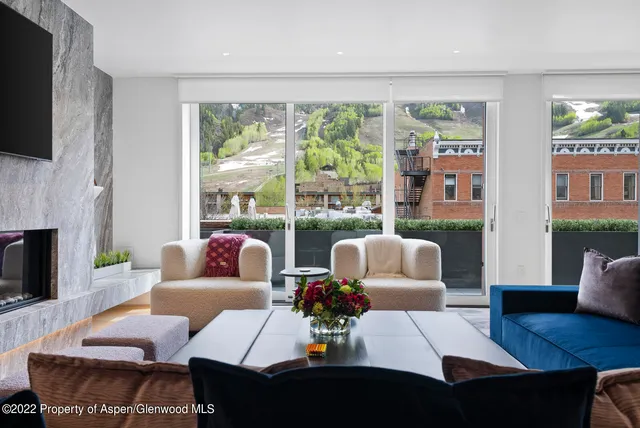 a living room with furniture fireplace and a flat screen tv