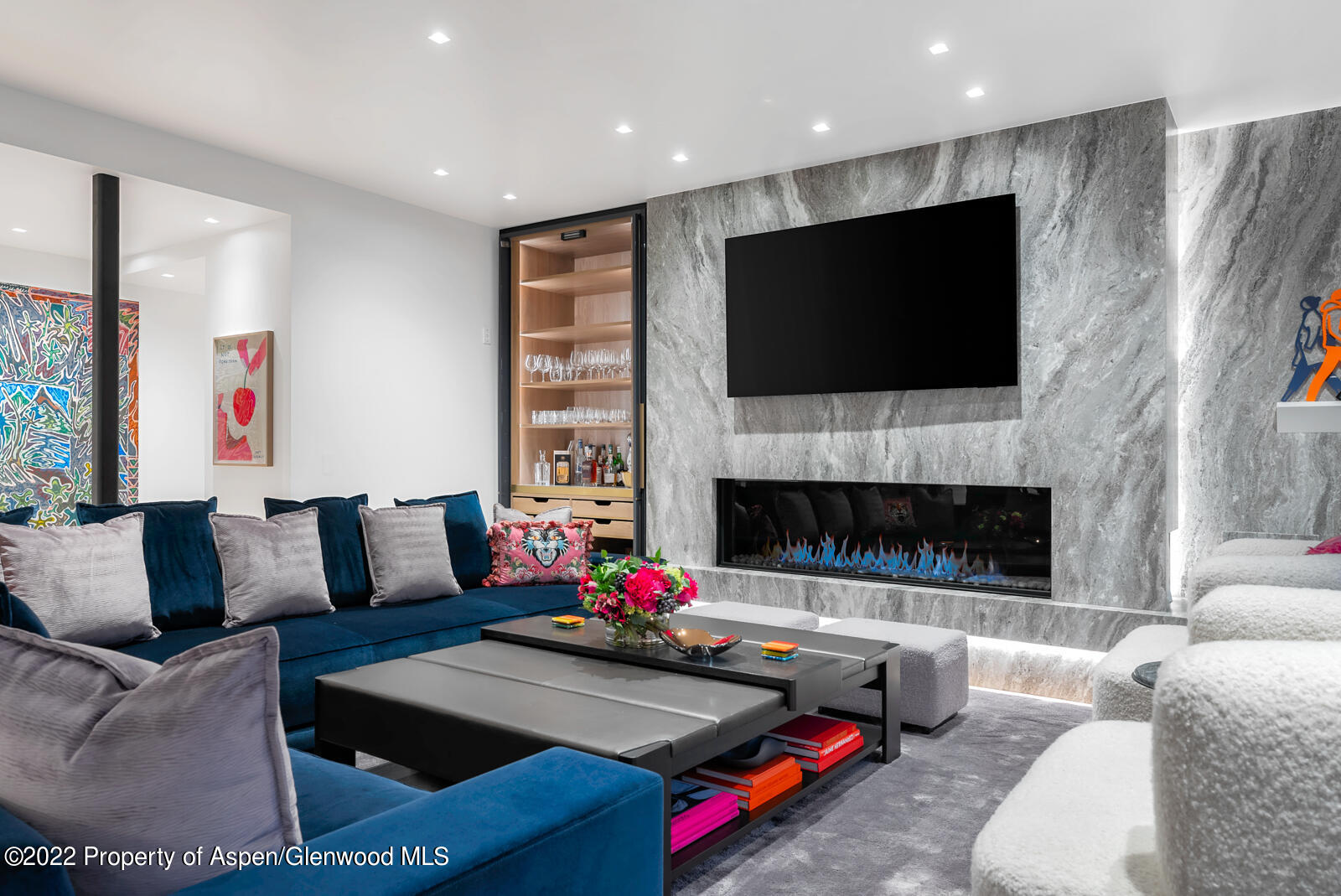 508 East Cooper Avenue, Unit 201 Aspen, CO 81611 - Photo 7 of 54 a living room with furniture fireplace and flat screen tv