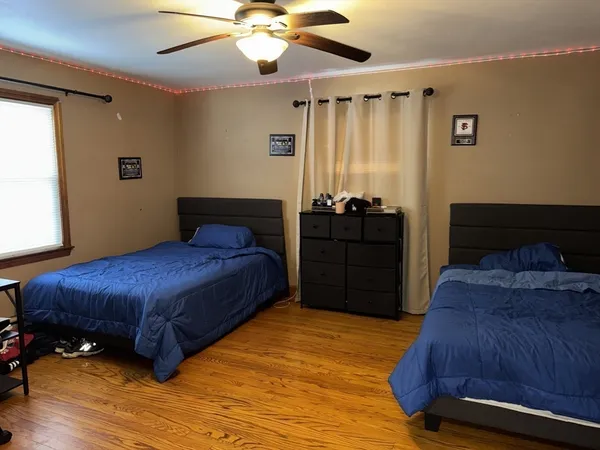 a bedroom with a bed and window