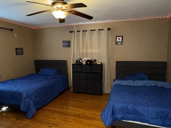 a bedroom with a bed and cabinets