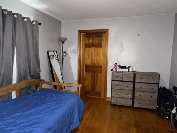 a bed room with a bed and a desk